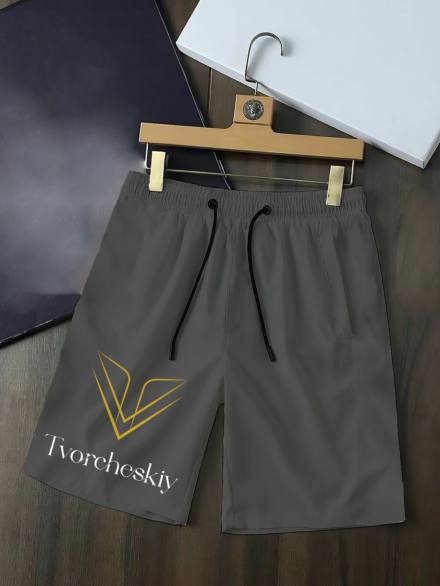 long gray tvorcheskiy shorts for men hanged in a table